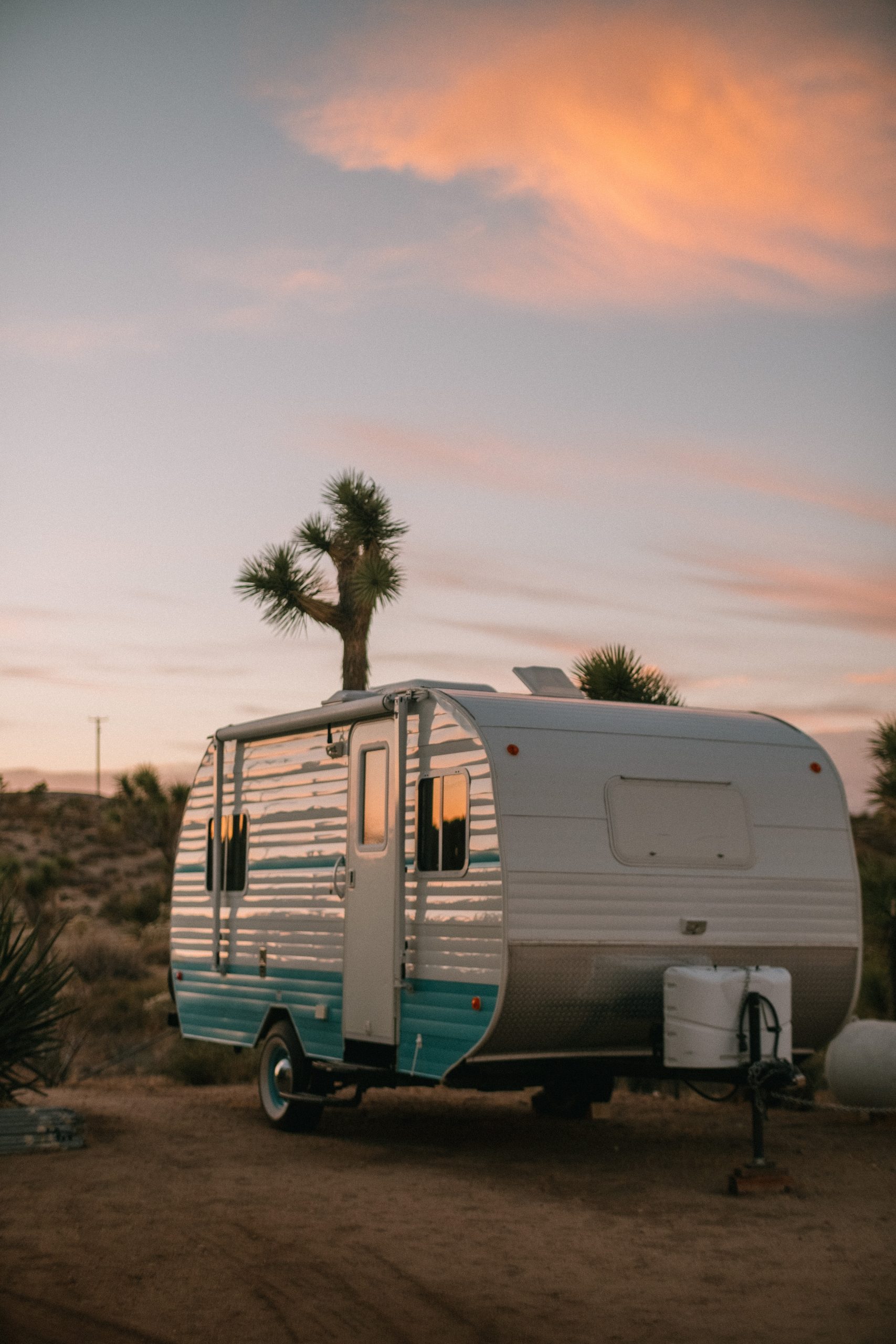 Key Benefits of Self Storage for Caravans White and blue caravan in the sunset