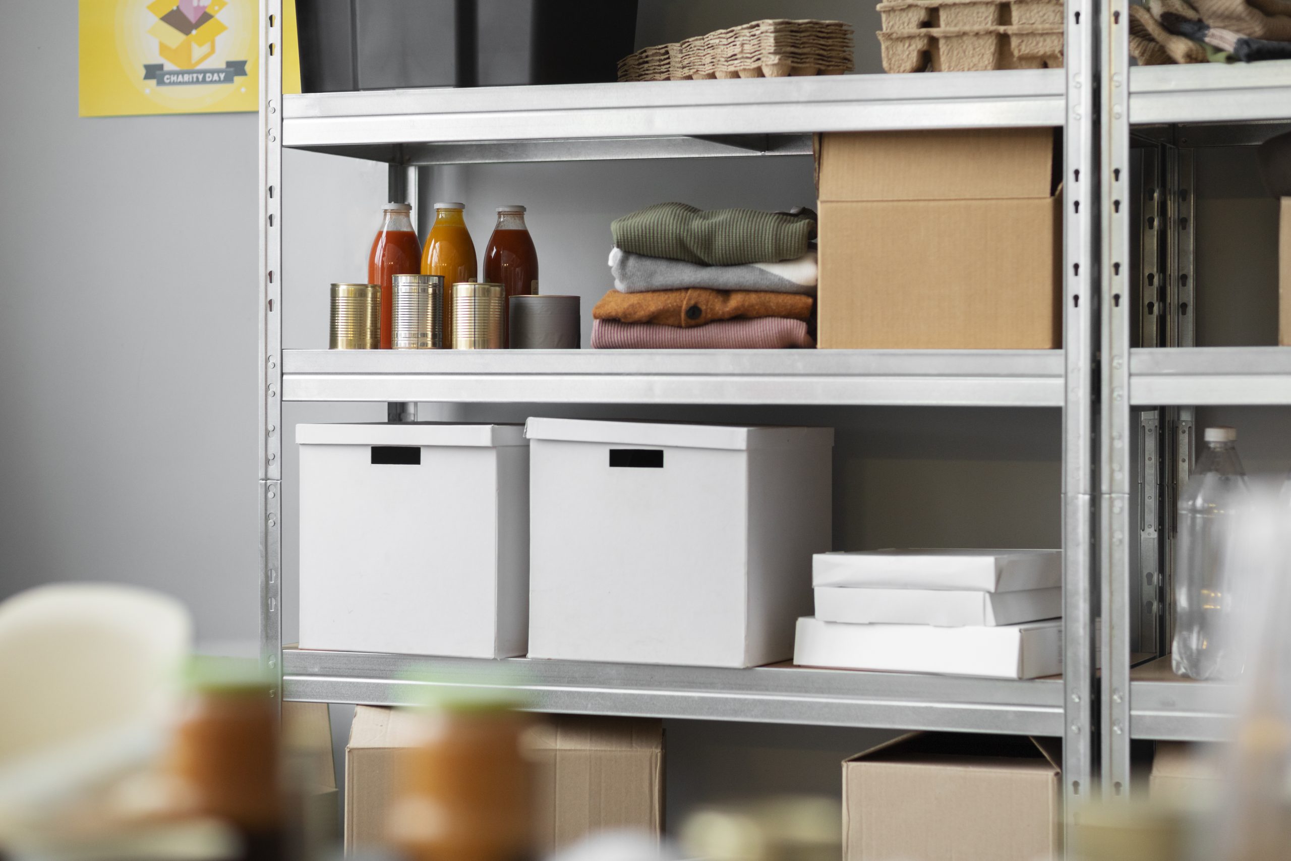 A self storage space filled with shelves and boxes.