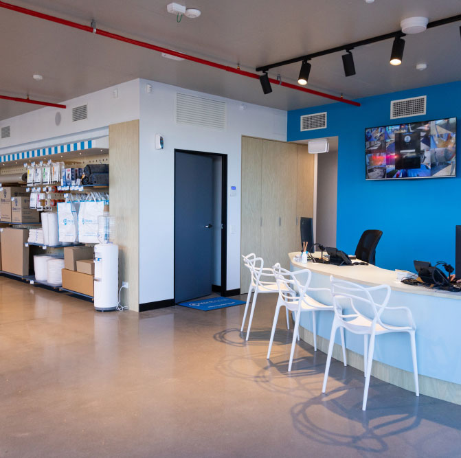 http://The%20reception%20area%20of%20a%20large%20office%20with%20blue%20walls.