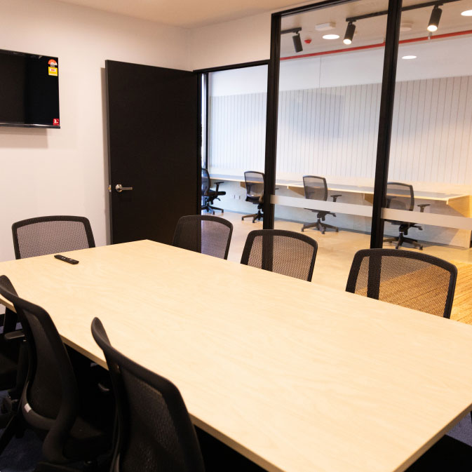 http://A%20conference%20room%20with%20a%20large%20table%20and%20chairs.