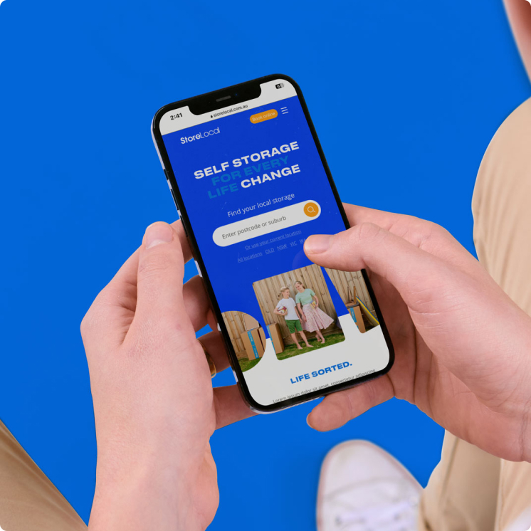 size-guidance-img A person holding a phone with a blue background and a text message on it.