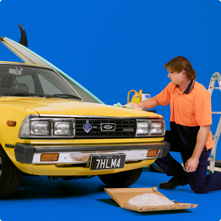 vehicle-storage-img A yellow car on a blue background.
