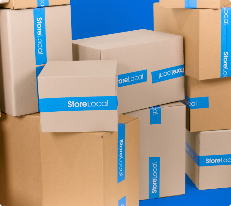 move-in-img1 A stack of boxes with the word local on them.