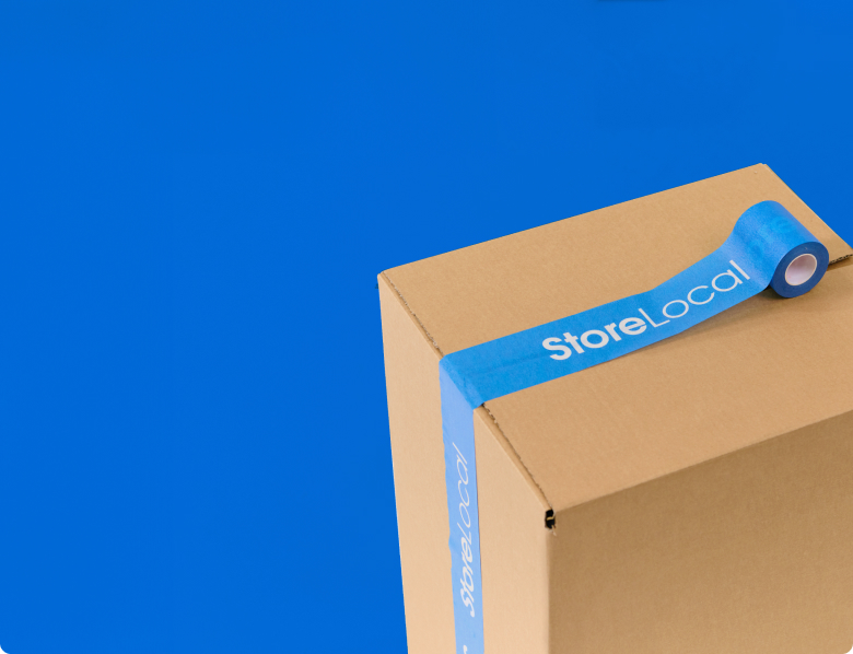 thank-you-banner-mobile A cardboard box with blue tape on a blue background.